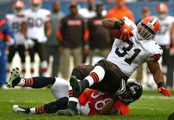 CHICAGO - NOVEMBER 01: Danieal Manning #38 of the Chicago Bears takes down Jamal Lewis #31 of the Cleveland Browns at Soldier Field on November 1, 2009 in Chicago, Illinois. The Bears defeated the Browns 30-6. (Photo by Jonathan Daniel/Getty Images)