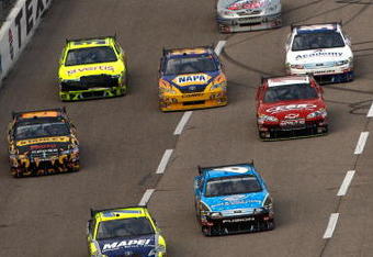 FORT WORTH, TX - NOVEMBER 08:  Regan Smith, driver of the #78 Furniture Row Chevrolet, leads a group of cars during the NASCAR Sprint Cup Series Dickies 500 at Texas Motor Speedway on November 8, 2009 in Fort Worth, Texas.  (Photo by Chris Graythen/Getty Images)