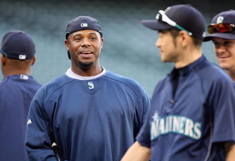SEATTLE - SEPTEMBER 18:  Ken Griffey Jr. #24 of the Seattle Mariners laughs with Ichiro Suzuki #51 during practice before the game against the New York Yankees on September 18, 2009 at Safeco Field in Seattle, Washington. (Photo by Otto Greule Jr/Getty Images) 