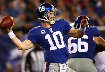 EAST RUTHERFORD, NJ - NOVEMBER 08:  Eli Manning #10 of the New York Giants looks to pass  against the San Diego Chargers on November 8, 2009 at Giants Stadium in East Rutherford, New Jersey.  (Photo by Chris McGrath/Getty Images)