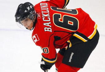 MISSISSAUGA, CANADA - AUGUST 26:  Mikael Backlund #60 of the Calgary Flames gets set for a face-off during the Upper Deck NHL Rookie Debut at the Hershey Centre August 26, 2009 in Mississauga, Ontario, Canada.  (Photo By Dave Sandford/Getty Images)