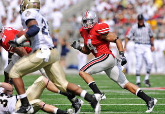 COLUMBUS, OH - SEPTEMBER 05:  Kurt Coleman #4 of the Ohio State Buckeyes chases down a Navy Midshipmen ballcarrier at Ohio Stadium on September 5, 2009 in Columbus, Ohio.  (Photo by Jamie Sabau/Getty Images)