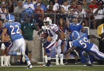 CANTON, OH - AUGUST 9: Roscoe Parrish #11 of the Buffalo Bills looks for running room after catching a pass against the Tennessee Titans during the Pro Football Hall of Fame Game at Fawcett Stadium on August 9, 2009 in Canton, Ohio. The Titans defeated the Bills 21-18. (Photo by Joe Robbins/Getty Images)