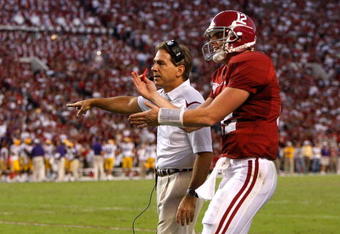TUSCALOOSA, AL - NOVEMBER 07:  Quarterback Greg McElroy #12 and head coach Nick Saban of the Alabama Crimson Tide question an intentional grounding penalty that led to a safety for the Louisiana State University Tigers at Bryant-Denny Stadium on November 7, 2009 in Tuscaloosa, Alabama.  (Photo by Kevin C. Cox/Getty Images)