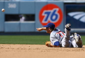 LOS ANGELES, CA - AUGUST 23:  Mike Fontenot #17 of the Chicago Cubs throws from his stomach to get Juan Pierre of the Los Angeles Dodgers out at second in the sixth inning at Dodger Stadium on August 23, 2009 in Los Angeles, California. The Cubs defeated the Dodgers 3-1.  (Photo by Jeff Gross/Getty Images)