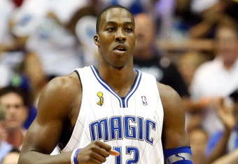 ORLANDO, FL - JUNE 14:  Dwight Howard #12 of the Orlando Magic reacts in the first quarter of Game Five of the 2009 NBA Finals against the Los Angeles Lakers on June 14, 2009 at Amway Arena in Orlando, Florida.  NOTE TO USER:  User expressly acknowledges and agrees that, by downloading and or using this photograph, User is consenting to the terms and conditions of the Getty Images License Agreement.  (Photo by Ronald Martinez/Getty Images)