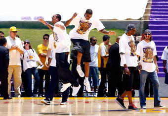 LOS ANGELES, CA - JUNE 17:  (L-R) Shannon Brown, Trevor Ariza, DJ Mbenga and Sasha Vujacic of the Los Angeles Lakers celebrate on stage during the 2009 NBA Championship Victory Parade at the Los Angeles Memorial Coliseum on June 17, 2009 in Los Angeles, California.  (Photo by Jeff Gross/Getty Images)