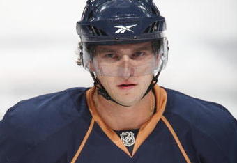 EDMONTON, CANADA - SEPTEMBER 16:  Denis Grebeshkov #37 of the Edmonton Oilers looks on against the New York Islanders on September 16, 2009 at Rexall Place in Edmonton, Alberta, Canada. The Oilers won 3-2. (Photo by Dale MacMillan/Getty Images)
