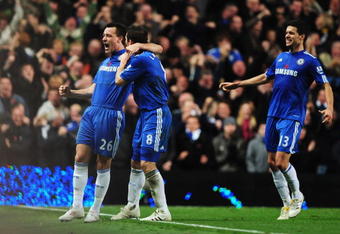 LONDON, ENGLAND - NOVEMBER 08:  John Terry (L) of Chelsea celebrates with teammate Frank Lampard (C) and Michael Ballack (R)  after scoring the opening goal during the Barclays Premier League match between Chelsea and Manchester United at Stamford Bridge on November 8, 2009 in London, England.  (Photo by Clive Mason/Getty Images)