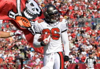 TAMPA, FL - OCTOBER 18:  Safeties Sabby Piscitelli #21 and Tanard Jackson #36 of the Tampa Bay Buccaneers celebrate Jackson's touchdown against the Carolina Panthers during the game at Raymond James Stadium on October 18, 2009 in Tampa, Florida.  (Photo by J. Meric/Getty Images)