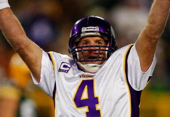 GREEN BAY, WI - NOVEMBER 01: Quarterback Brett Favre #4 of the Minnesota Vikings celebrates a touchdown by teammate Percy Harvin #12 after a 51 yard touchdown pass during the third quarter of the game against the Green Bay Packers at Lambeau Field on November 1, 2009 in Green Bay, Wisconsin. (Photo by Scott Boehm/Getty Images)