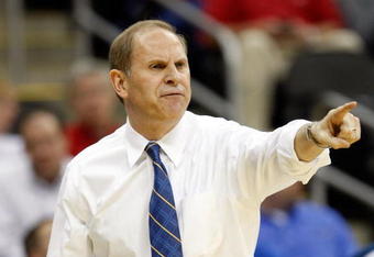 KANSAS CITY, MO - MARCH 19:  Head Coach John Beilein of the Michigan Wolverines points toward the court from the sideline during their first round game against the Clemson Tigers in the NCAA Division I Men's Basketball Tournament at the Sprint Center on March 19, 2009 in Kansas City, Missouri.  The Wolverines defeated the Tigers 62-59.  (Photo by Jamie Squire/Getty Images)