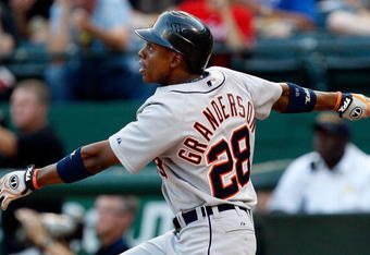 ARLINGTON, TX - JULY 29:  Center fielder Curtis Granderson #28 of the Detroit Tigers hits his second home run of the game in the second inning against the Texas Rangers on July 29, 2009 at Rangers Ballpark in Arlington, Texas.  (Photo by Ronald Martinez/Getty Images)