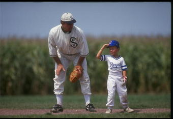 DYERSVILLE, IA - AUGUST 25: A 'ghost player' recreating the role of Chicago White Sox legend Shoeless Joe Jackson plays ball with a young tourist at the baseball field created for the motion picture 'Field of Dreams' on August 25, 1991 in Dyersville, Iowa. Rita and Al Ameskamp who, with Don and Becky Lansing, co-own the site have turned the cornfields and baseball diamond into a summertime tourist attraction, including 'ghost player' reenactments. (Photo by Jonathan Daniel/Getty Images)