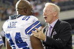 ARLINGTON, TX - AUGUST 21:  Dallas Cowboys team owner Jerry Jones talks with linebacker DeMarcus Ware #94 prior to the Cowboys taking the field against the Tennessee Titans during a preseason game at Cowboys Stadium on August 21, 2009 in Arlington, Texas. (Photo by Tom Pennington/Getty Images)