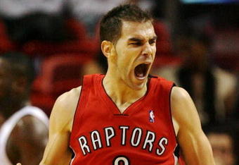 MIAMI - NOVEMBER 19:  Jose Calderon #8 of the Toronto Raptors celebrates after making a basket against the Miami Heat at American Airlines Arena on November 19, 2008 in Miami, Florida. The Raptors defeated the Heat 101-95. NOTE TO USER: User expressly acknowledges and agrees that, by downloading and/or using this Photograph, user is consenting to the terms and conditions of the Getty Images License Agreement.  (Photo by Doug Benc/Getty Images)