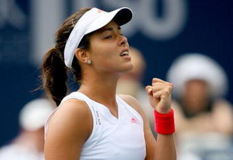 TORONTO, ON - AUGUST 18:  Ana Ivanovic of Serbia celebrates match point against Magdakena Rybarikova of Slovakia during the Rogers Cup at the Rexall Center on August 18, in Toronto, Ontario, Canada.  (Photo by Matthew Stockman/Getty Images)