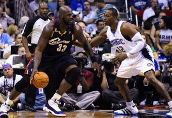 ORLANDO, FL - NOVEMBER 11:  Shaquille O'Neal #33 of the Cleveland Cavaliers looks to maneuver against Dwight Howard #12 of the Orlando Magic during the game on November 11, 2009 at Amway Arena in Orlando, Florida. NOTE TO USER: User expressly acknowledges and agrees that, by downloading and/or using this Photograph, user is consenting to the terms and conditions of the Getty Images License Agreement. (Photo by Sam Greenwood/Getty Images)