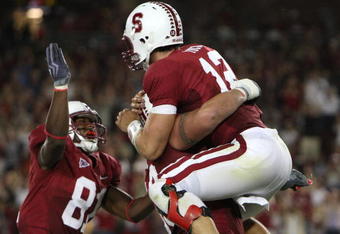 PALO ALTO, CA - SEPTEMBER 26:  Andrew Luck #12 of the Stanford Cardinal celebrates after rushing for a touchdown in the fourth quarter against the Washington Huskies at Stanford Stadium on September 26, 2009 in Palo Alto, California.  (Photo by Jed Jacobsohn/Getty Images)