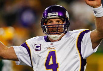 GREEN BAY, WI - NOVEMBER 01: Quarterback Brett Favre #4 of the Minnesota Vikings celebrates a touchdown by teammate Percy Harvin #12 after a 51 yard touchdown pass during the third quarter of the game against the Green Bay Packers at Lambeau Field on November 1, 2009 in Green Bay, Wisconsin. (Photo by Scott Boehm/Getty Images)