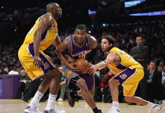 LOS ANGELES, CA - FEBRUARY 26:  Leandro Barbosa #10 of the Phoenix Suns drives the ball past Didier Ilunga-Mbenga #28 and Sasha Vujacic #18 of the Los Angeles Lakers during the NBA game against the Los Angeles Lakers at Staples Center on February 26, 2009 in Los Angeles, California.    The Lakers defeated the Suns 132-106.  NOTE TO USER: User expressly acknowledges and agrees that, by downloading and or using this Photograph, user is consenting to the terms and conditions of the Getty Images License Agreement.  (Photo by Christian Petersen/Getty Images)