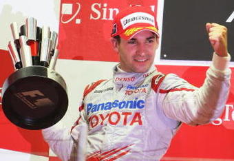 SINGAPORE - SEPTEMBER 27:  Timo Glock of Germany and Toyota celebrates on the podium after finishing second during the Singapore Formula One Grand Prix at the Marina Bay Street Circuit on September 27, 2009 in Singapore.  (Photo by Mark Thompson/Getty Images)
