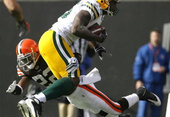 CLEVELAND, OH - OCTOBER 25:  Donald Lee #86 of the Green Bay Packers is hit by Brandon McDonald #22 of the Cleveland Browns at Cleveland Browns Stadium on October 25, 2009 in Cleveland, Ohio.  (Photo by Matt Sullivan/Getty Images)