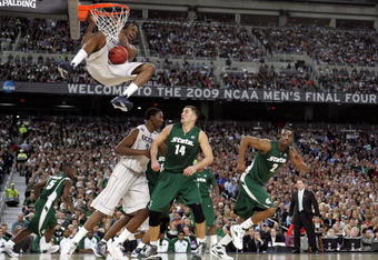 DETROIT - APRIL 04:  Stanley Robinson #21 of the Connecticut Huskies dunks against Goran Suton #14 of the Michigan State Spartans during the National Semifinal game of the NCAA Division I Men's Basketball Championship at Ford Field on April 4, 2009 in Detroit, Michigan. Michigan State won 82-73. (Photo by Andy Lyons/Getty Images)