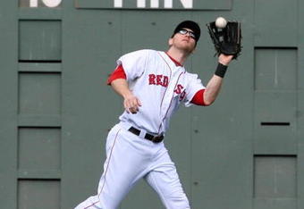 BOSTON - OCTOBER 11:  Jason Bay #44 of the Boston Red Sox catches a Torii Hunter #48 of the Los Angeles Angels of Anaheim fly ball in the third inning of Game Three of the ALDS during the 2009 MLB Playoffs at Fenway Park on October 11, 2009 in Boston,  Massachusetts. (Photo by Jim Rogash/Getty Images)