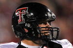 NORMAN, OK - NOVEMBER 22:  Quarterback Graham Harrell #6 of the Texas Tech Red Raiders drops back to pass against the Oklahoma Sooners in the first quarter at Memorial Stadium on November 22, 2008 in Norman, Oklahoma.  (Photo by Ronald Martinez/Getty Images)