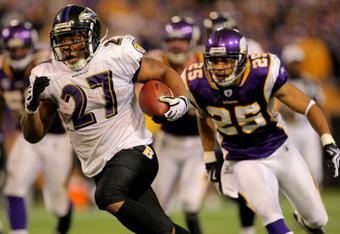 MINNEAPOLIS - OCTOBER 18:  Running back Ray Rice #27 of the Baltimore Ravens eludes Tyrell Johnson #25 of the Minnesota Vikings as he rushes 33 yards for a fourth quarter touchdown during NFL action at Hubert H. Humphrey Metrodome on October 18, 2009 in Minneapolis, Minnesota. The Vikings defeated the Ravens 33-31.  (Photo by Doug Pensinger/Getty Images)