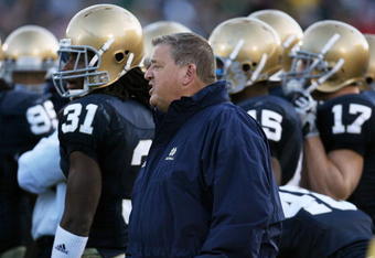 SOUTH BEND, IN - OCTOBER 17: Head coach Charlie Weis of the Notre Dame Fighting Irish gives instructions to his team during a game against the USC Trojans at Notre Dame Stadium on October 17, 2009 in South Bend, Indiana. USC defeated Notre Dame 34-27. (Photo by Jonathan Daniel/Getty Images)