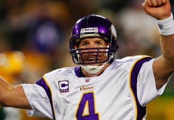 GREEN BAY, WI - NOVEMBER 01: Quarterback Brett Favre #4 of the Minnesota Vikings celebrates a touchdown by teammate Percy Harvin #12 after a 51 yard touchdown pass during the third quarter of the game against the Green Bay Packers at Lambeau Field on November 1, 2009 in Green Bay, Wisconsin. (Photo by Scott Boehm/Getty Images)