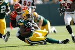 GREEN BAY, WI - SEPTEMBER 20: Tight end Jermichael Finley #88 of the Green Bay Packers is tackled by defensive back Roy Williams #31 of the Cincinnati Bengals at Lambeau Field on September 20, 2009 in Green Bay, Wisconsin. The Bengals defeated the Packers 31-24. (Photo by Scott Boehm/Getty Images)