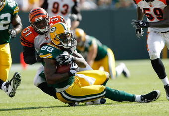 GREEN BAY, WI - SEPTEMBER 20: Tight end Jermichael Finley #88 of the Green Bay Packers is tackled by defensive back Roy Williams #31 of the Cincinnati Bengals at Lambeau Field on September 20, 2009 in Green Bay, Wisconsin. The Bengals defeated the Packers 31-24. (Photo by Scott Boehm/Getty Images)