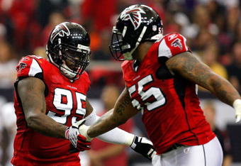ATLANTA - NOVEMBER 08:  Jonathan Babineaux #95 and John Abraham #55 of the Atlanta Falcons celebrate a sack against the Washington Redskins at Georgia Dome on November 8, 2009 in Atlanta, Georgia.  (Photo by Kevin C. Cox/Getty Images)
