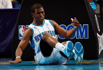 NEW ORLEANS - NOVEMBER 04:  Chris Paul #3 of the New Orleans Hornets sits on the ground after being fouled during the game against  the Dallas Mavericks at New Orleans Arena on November 4, 2009 in New Orleans, Louisiana.  NOTE TO USER: User expressly acknowledges and agrees that, by downloading and or using this photograph, User is consenting to the terms and conditions of the Getty Images License Agreement.  (Photo by Chris Graythen/Getty Images)