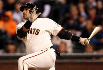 SAN FRANCISCO - AUGUST 26:  Bengie Molina #1 of the San Francisco Giants hits a pinch hit 3 run home run to give the Giants a 4-3 lead in the eighth inning of their game against the Arizona Diamondbacks at AT&T Park on August 26, 2009 in San Francisco, California.  (Photo by Ezra Shaw/Getty Images for Reebok)