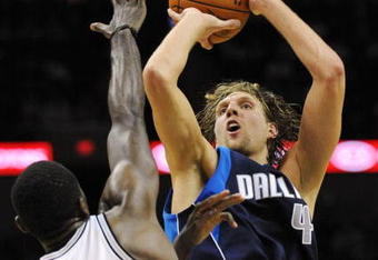 SAN ANTONIO - NOVEMBER 11:  Dirk Nowitzki #41 of the Dallas Mavericks shoots a jumper against Antonio McDyess #34 of the San Antonio Spurs during the game at AT&T Center on November 11, 2009 in San Antonio, Texas.  NOTE TO USER: User expressly acknowledges and agrees that, by downloading and or using this photograph, User is consenting to the terms and conditions of the Getty Images License Agreement. (Photo by Ronald Martinez/Getty Images)