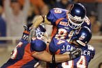 BOISE, ID - SEPTEMBER 24:  Klayton Adams (L) and Jeff Cavender (R) celebrate the game winning touchdown that T.J. Acree caught for Boise State in a game against BYU September 24, 2004 at Broncos Stadium in Boise, Idaho. BSU won the game 28-27. (Photo by George Frey/Getty Images)