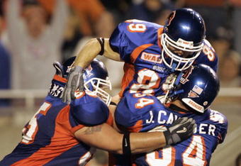 BOISE, ID - SEPTEMBER 24:  Klayton Adams (L) and Jeff Cavender (R) celebrate the game winning touchdown that T.J. Acree caught for Boise State in a game against BYU September 24, 2004 at Broncos Stadium in Boise, Idaho. BSU won the game 28-27. (Photo by George Frey/Getty Images)