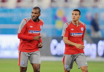 DOHA, QATAR - NOVEMBER 13: Darren Bent warms up with Jermaine Jenas during the England training session at the Khalifa Stadium on November 13, 2009 in Doha, Qatar.  (Photo by Michael Regan/Getty Images)