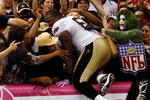 NEW ORLEANS - OCTOBER 04:  Anthony Hargrove #69 of the New Orleans Saints jumps into the crowd after defeating the New York Jets 24-10 at the Louisana Superdome on October 4, 2009 in New Orleans, Louisiana.  The Saints defeated the Jets 24-10.  (Photo by Chris Graythen/Getty Images)