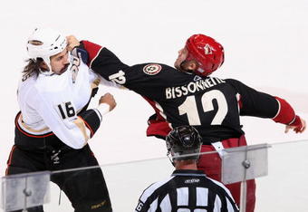 GLENDALE, AZ - OCTOBER 31:  George Parros #16 of the Anaheim Ducks fights with Paul Bissonnette #12 of the Phoenix Coyotes during the first period of the NHL game at Jobing.com Arena on October 31, 2009 in Glendale, Arizona.  (Photo by Christian Petersen/Getty Images)