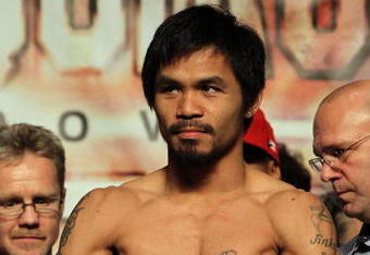 LAS VEGAS - NOVEMBER 13:  Manny Pacquiao weighs in for his upcoming bout against WBO welterweight champion Miguel Cotto at the MGM Grand Garden Arena on November 13, 2009 in Las Vegas, Nevada. Pacquiao and Cotto will meet in a WBO welterweight title fight at the MGM Grand on November 14.  Pacquiao weighed in at 144 pounds and Cotto weighed in at 145 pounds.  (Photo by Al Bello/Getty Images)