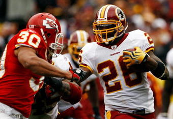 LANDOVER, MD - OCTOBER 18:  Mike Brown #30 of the Kansas City Chiefs tackles Clinton Portis #26 of the Washington Redskins during their game October 18, 2009 at FedEx Field in Landover, Maryland.The Chiefs won the game 14-6.  (Photo by Win McNamee/Getty Images)