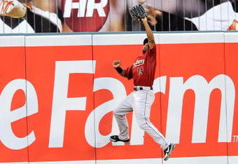 BALTIMORE - JUNE 18:  Michael Bourn #14 of the Houston Astros makes a leaping catch against the Baltimore Orioles at Camden Yards June 18, 2008 in Baltimore, Maryland.  (Photo by Greg Fiume/Getty Images)