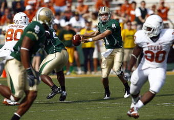 WACO, TX - NOVEMBER 14:  Quarterback Nick Florence #11 of the Baylor Bears drops back to pass during the first half against the Texas Longhorns on November 14, 2009 at Floyd Casey Stadium in Waco, Texas.  The Longhorns beat the Bears 47-14.  (Photo by Tom Pennington/Getty Images)