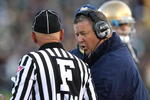 SOUTH BEND, IN - OCTOBER 17: Head coach Charlie Weis of the Notre Dame Fighting Irish talks with a referee during a game against the USC Trojans at Notre Dame Stadium on October 17, 2009 in South Bend, Indiana. USC defeated Notre Dame 34-27.  (Photo by Jonathan Daniel/Getty Images)