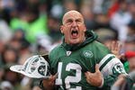 EAST RUTHERFORD, NJ - OCTOBER 18:  New York Jets fan fireman Ed Anzalone cheers during the game between The New York Jets against The Buffalo Bills on October 18, 2009 at Giants Stadium in East Rutherford, New Jersey.  (Photo by Al Bello/Getty Images)